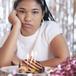 Birthday girl looking upset at her party