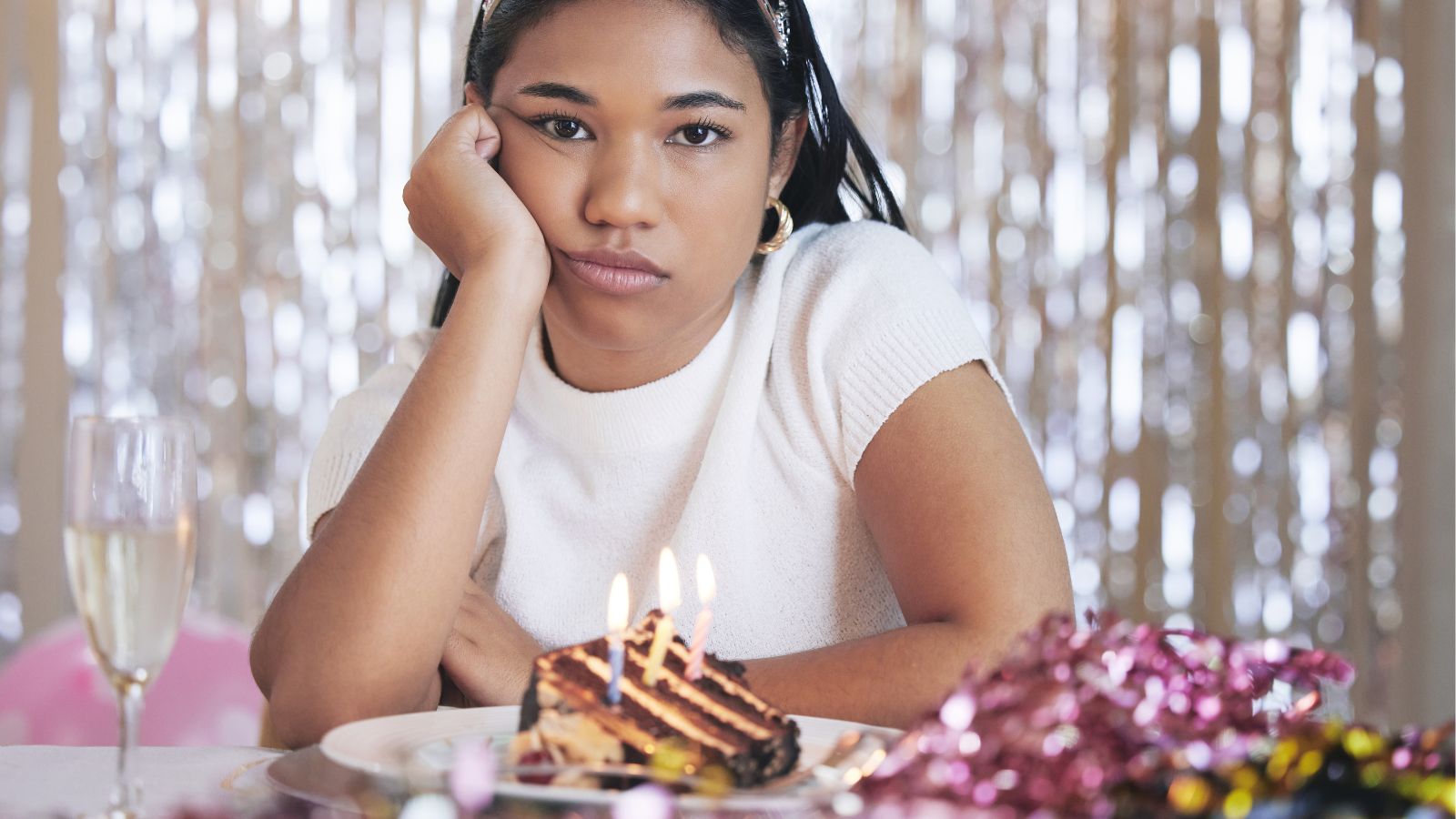 Birthday girl looking upset at her party