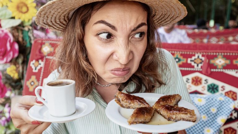Woman looking judgy at a plate of food