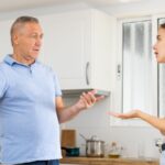 Young woman arguing with her father