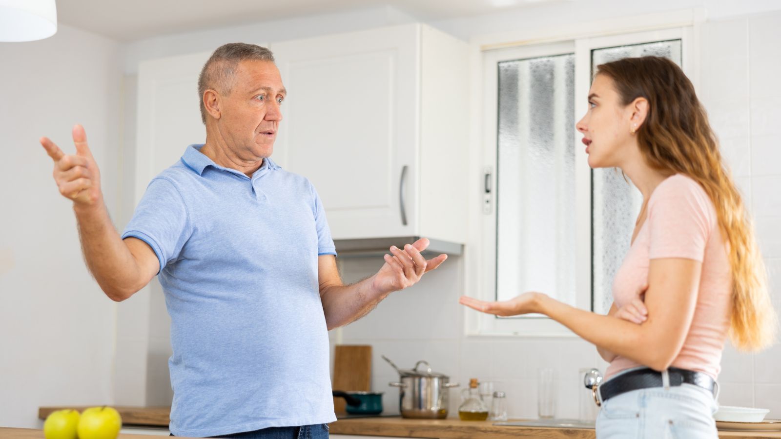 Young woman arguing with her father