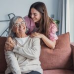 Younger woman caring for an older woman