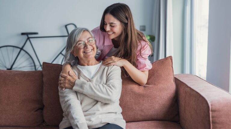 Younger woman caring for an older woman