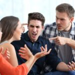Four friends arguing on a couch