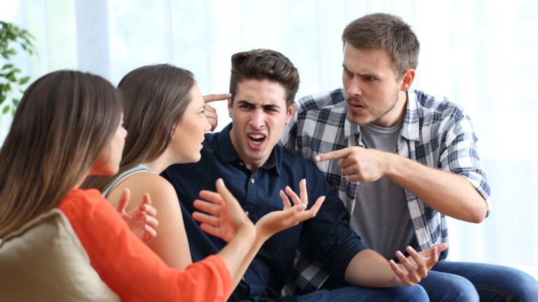Four friends arguing on a couch