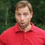 Man standing outside with a shocked look on his face