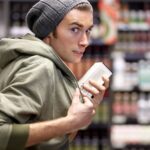 Young man shoplifting in a store