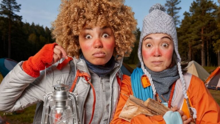Women looking cold and scared while camping