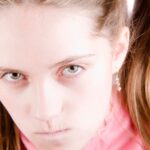 Closeup of teen girl looking bratty