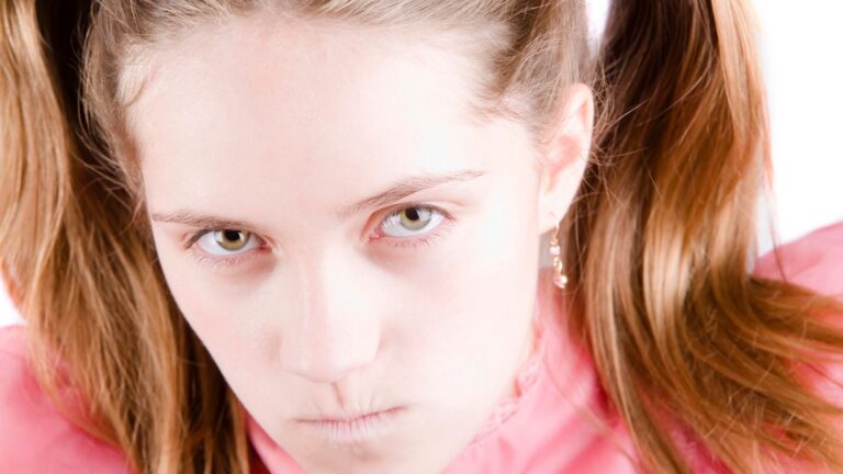 Closeup of teen girl looking bratty