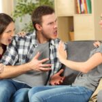 Roommates fighting on the couch
