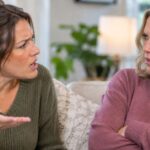 Two women talking and looking angry